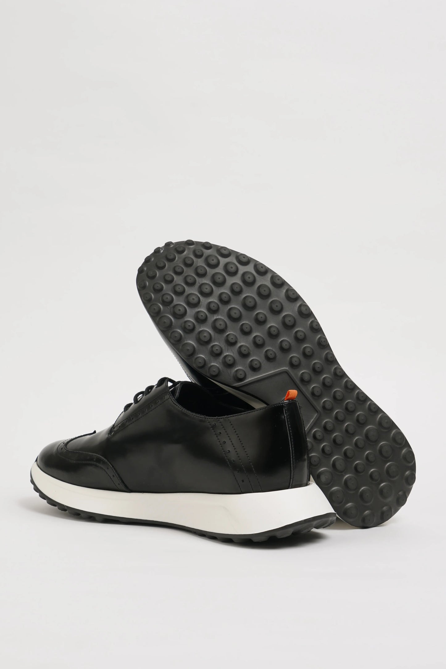 All Black Wingtip Leather Sneakers