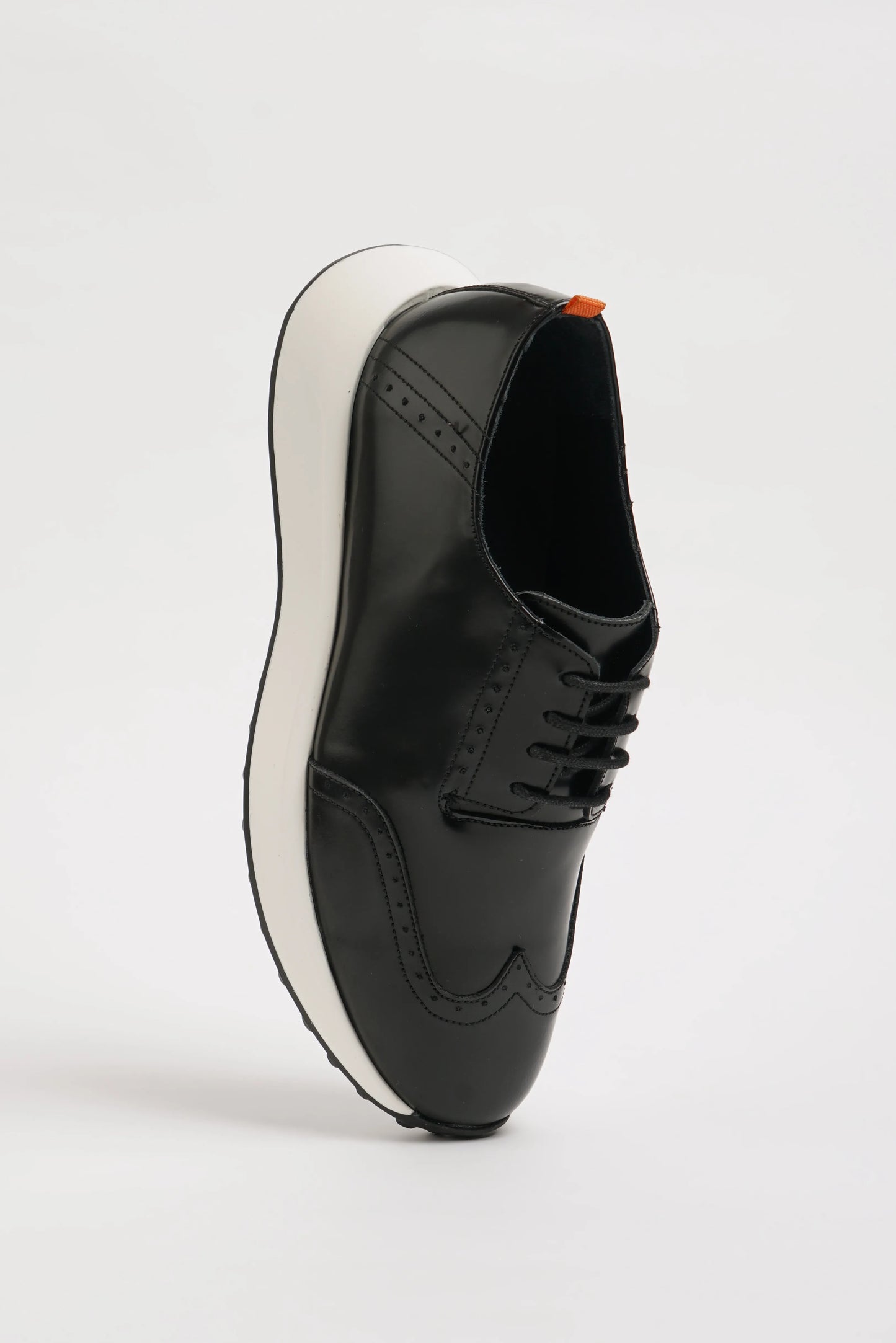 All Black Wingtip Leather Sneakers