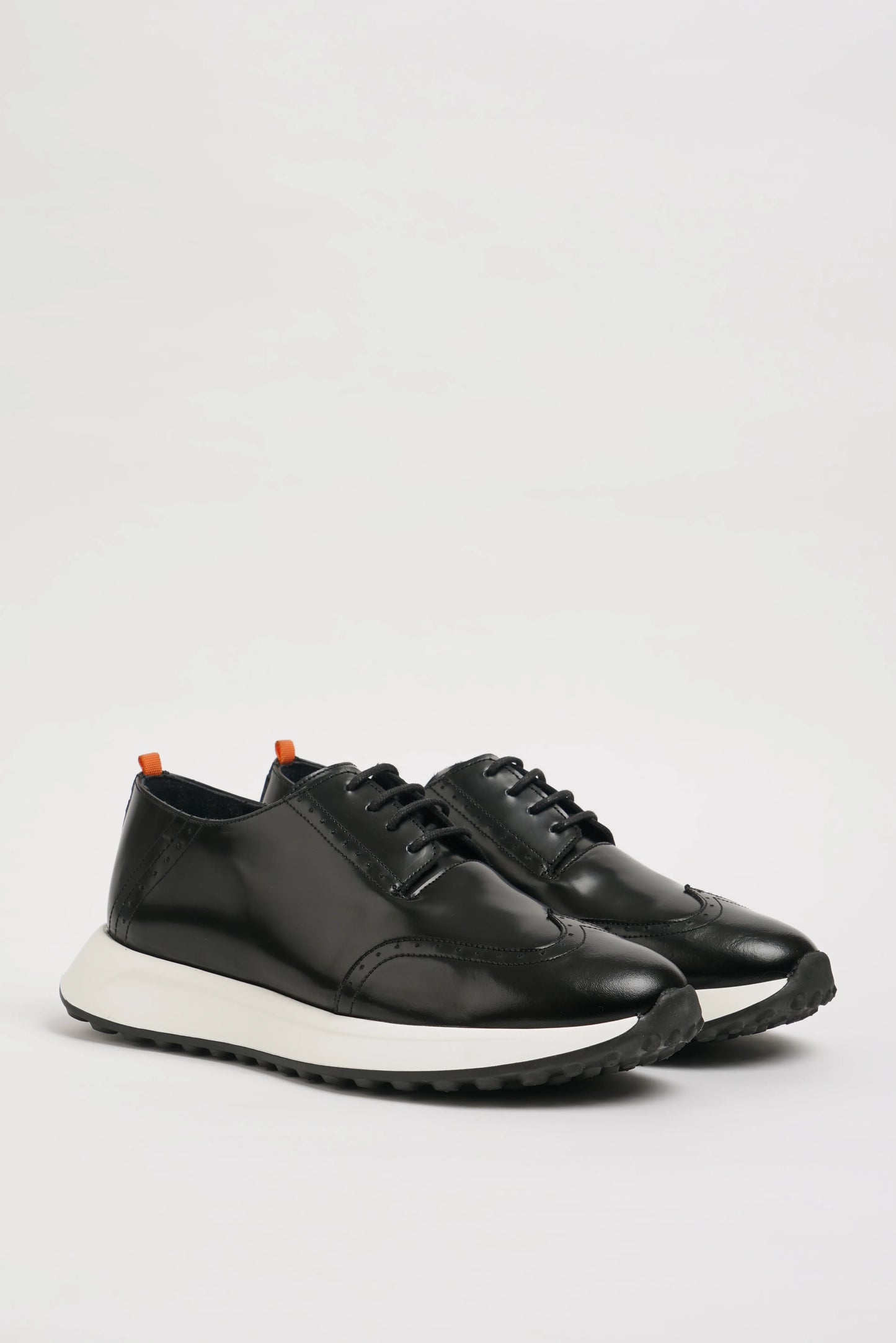 All Black Wingtip Leather Sneakers